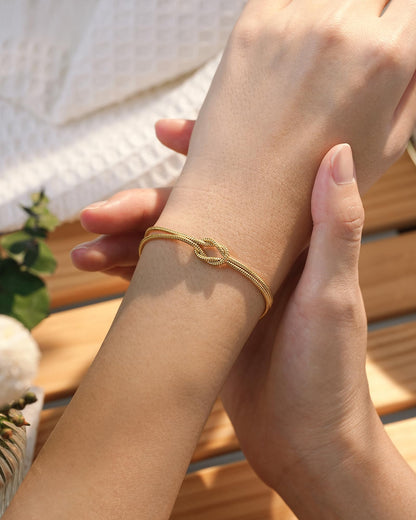 Women's Gold-Tone Stainless Steel Love Knot Charm Bracelet – Adjustable Chain